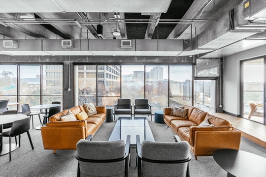 Lounge with leather seating and city views