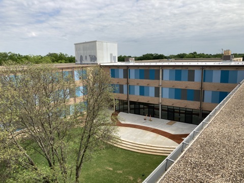 Renovated building exterior and courtyard from the roof