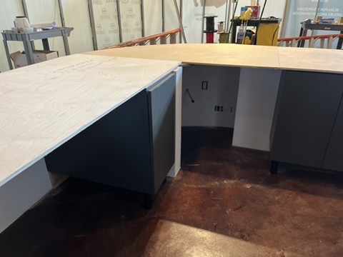 Counter base and cabinetry going in