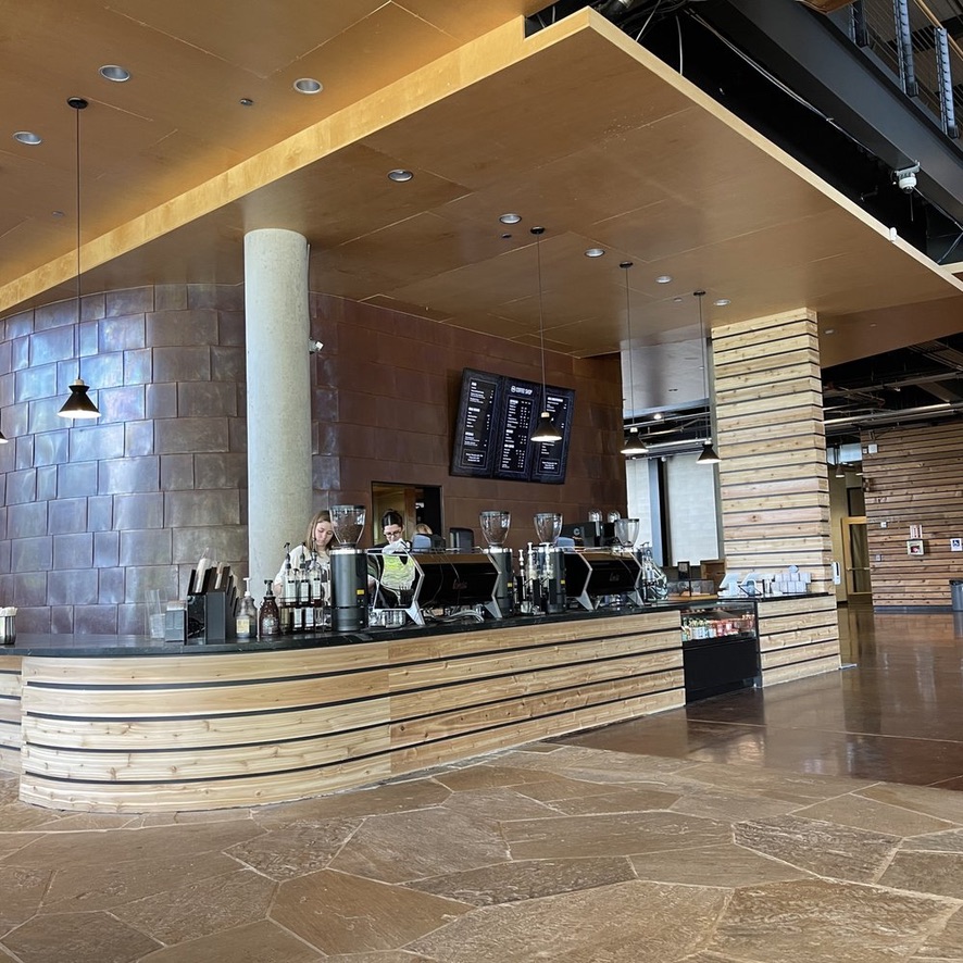 Completed coffee bar with menu boards and espresso line