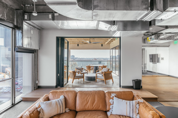 Interior lounge opening to a terrace